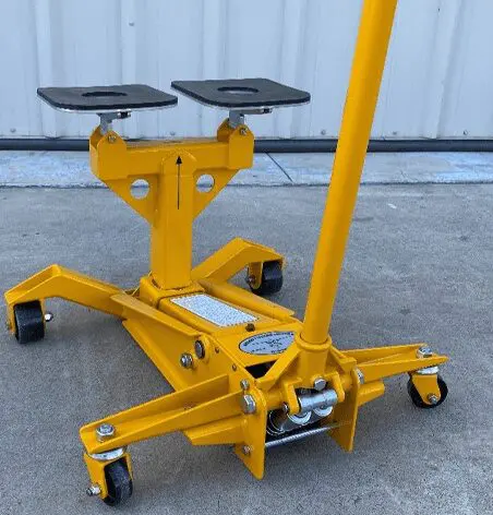 A yellow machine is sitting on the ground