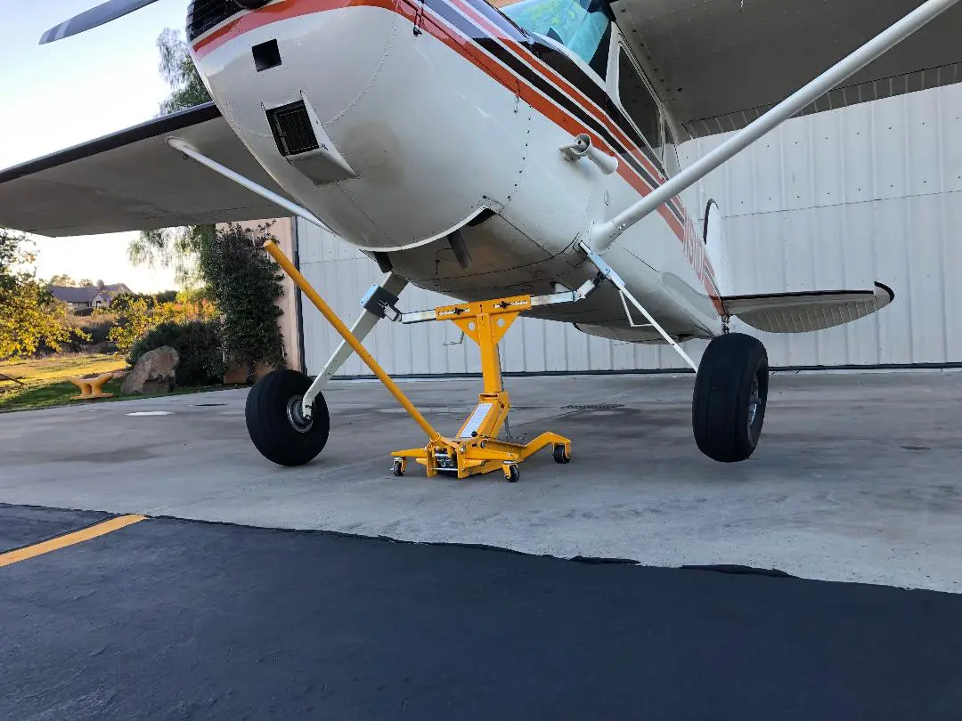 A small airplane sitting on top of concrete.