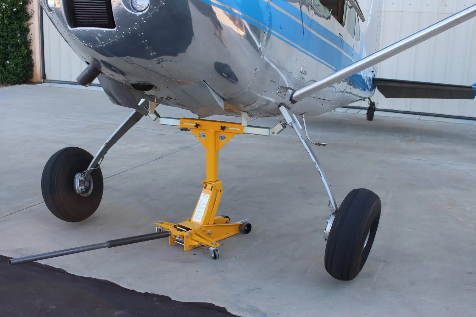 A small airplane sitting on top of concrete.