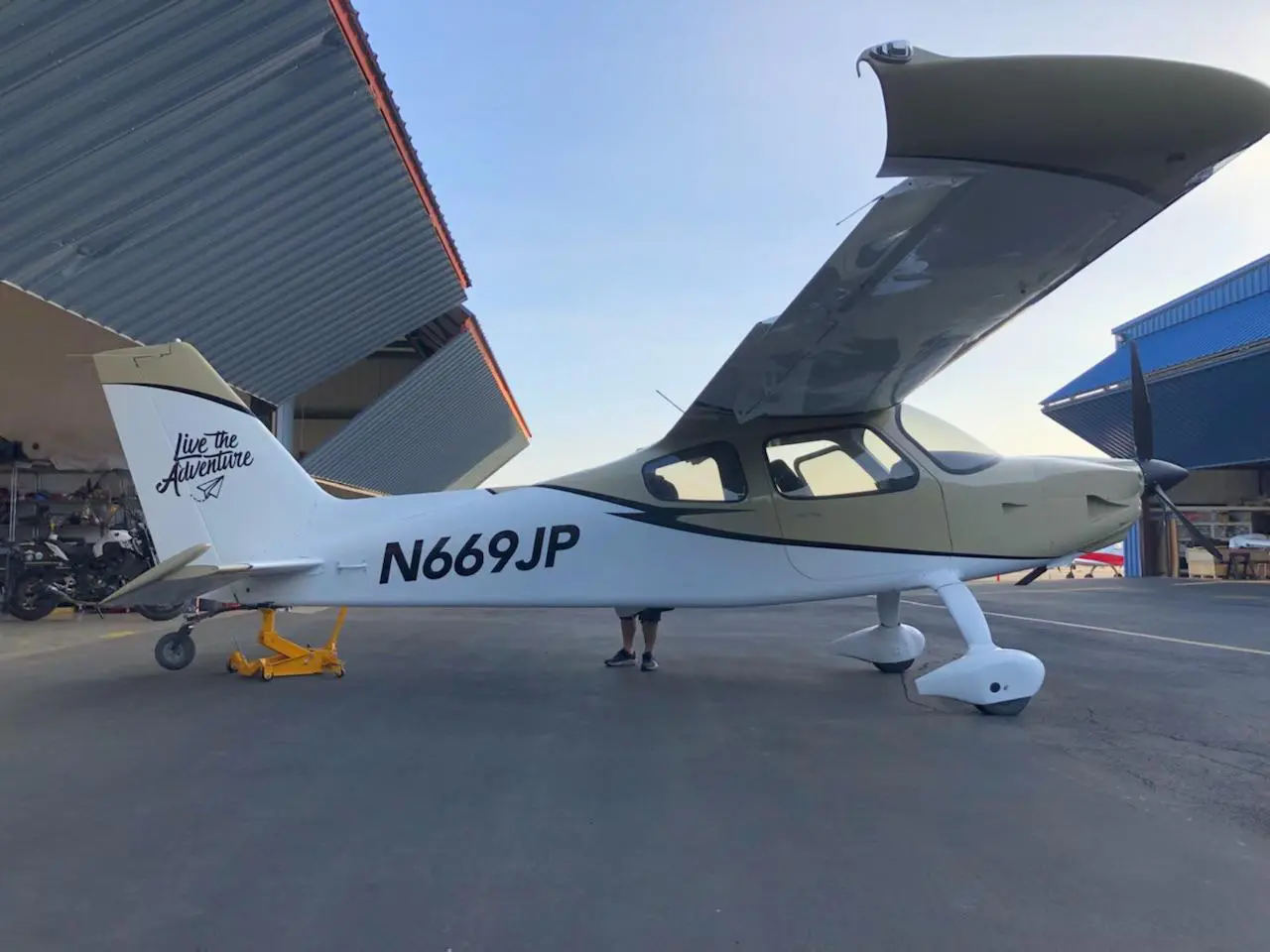 A small white plane sitting on top of an airport runway.